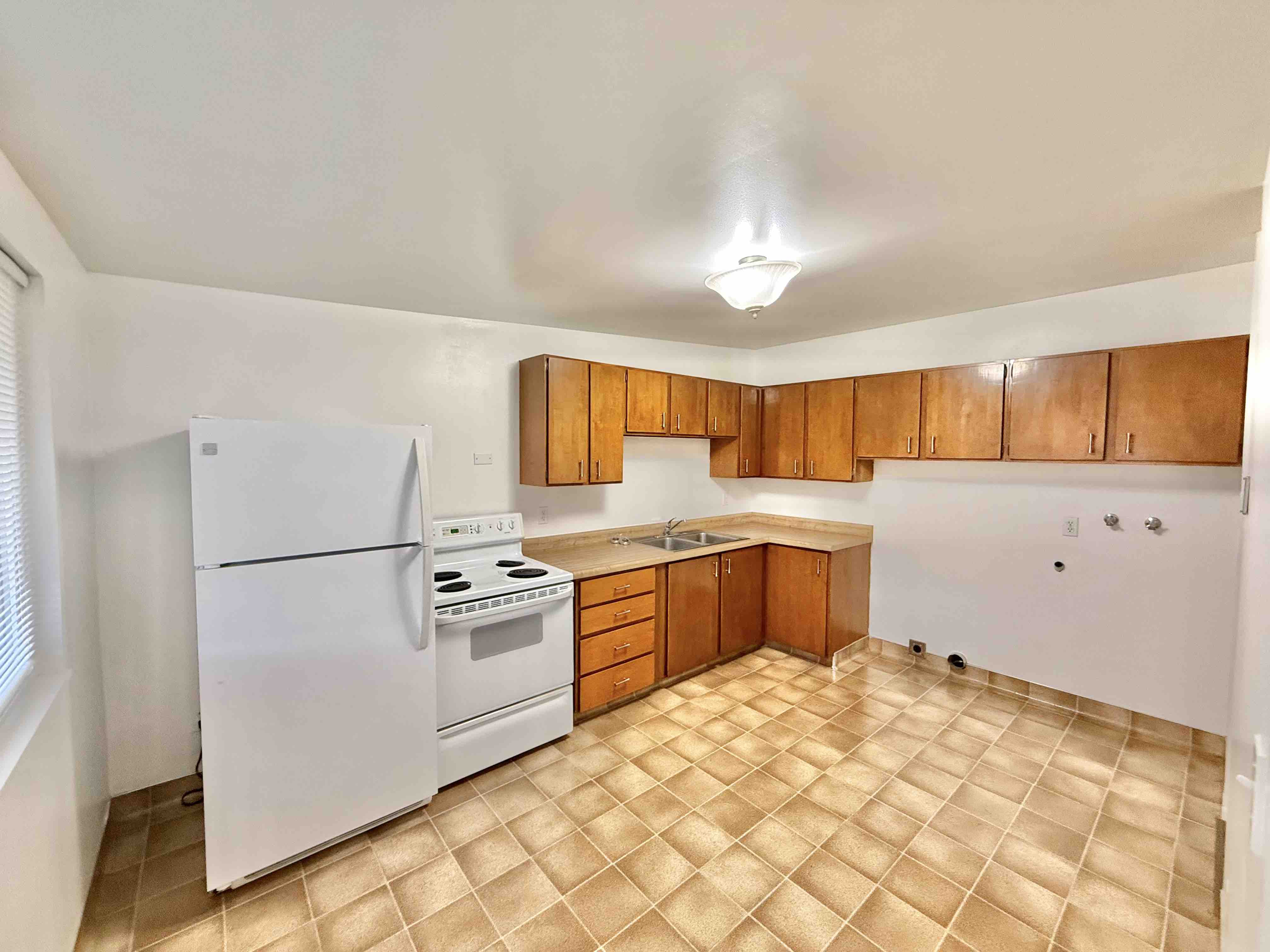 Modern kitchen with updated appliances in 2BR apartment