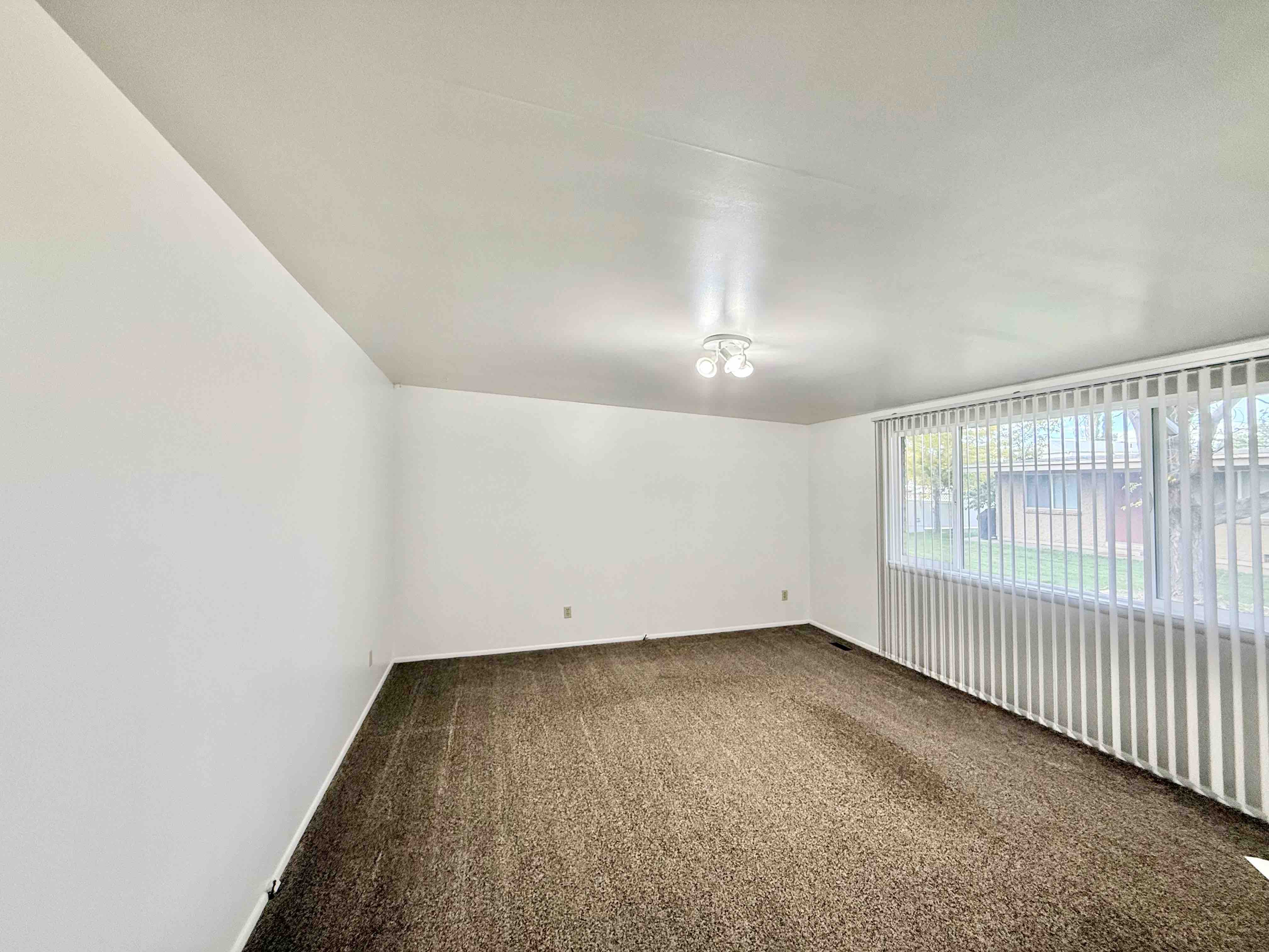 Spacious living room in 2 bedroom apartment at CDJK Apartments